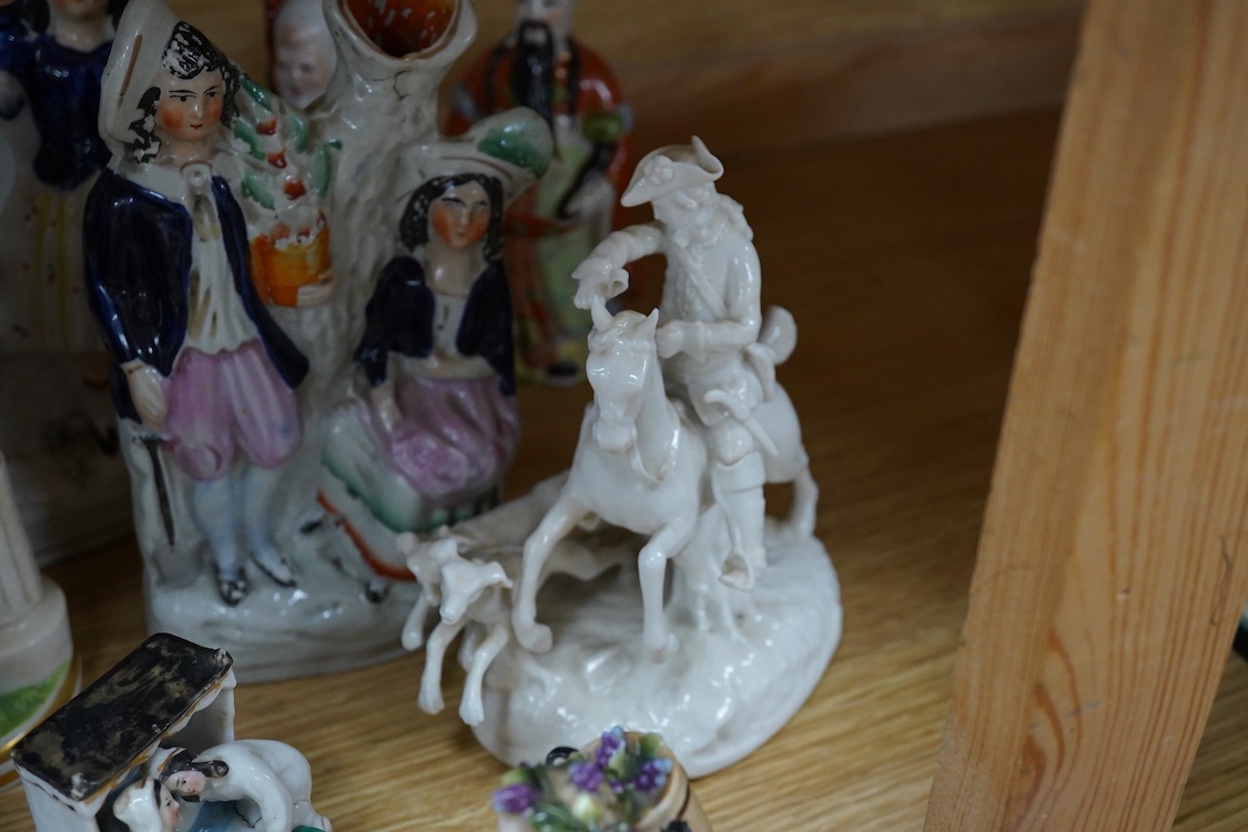 A collection of 19th century porcelain and ceramic figures, mostly Staffordshire, largest 28cm high
